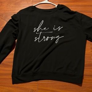 sweatshirt material long sleeve shirt that says “she is strong”